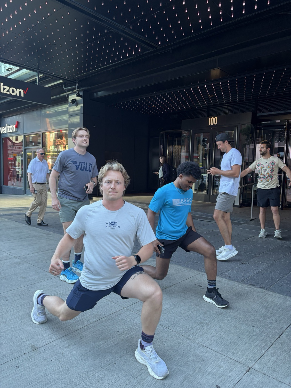 Pre-run stretching on the sidewalk